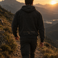 The Glory Be Hoodie worn on a mountain trail, back view