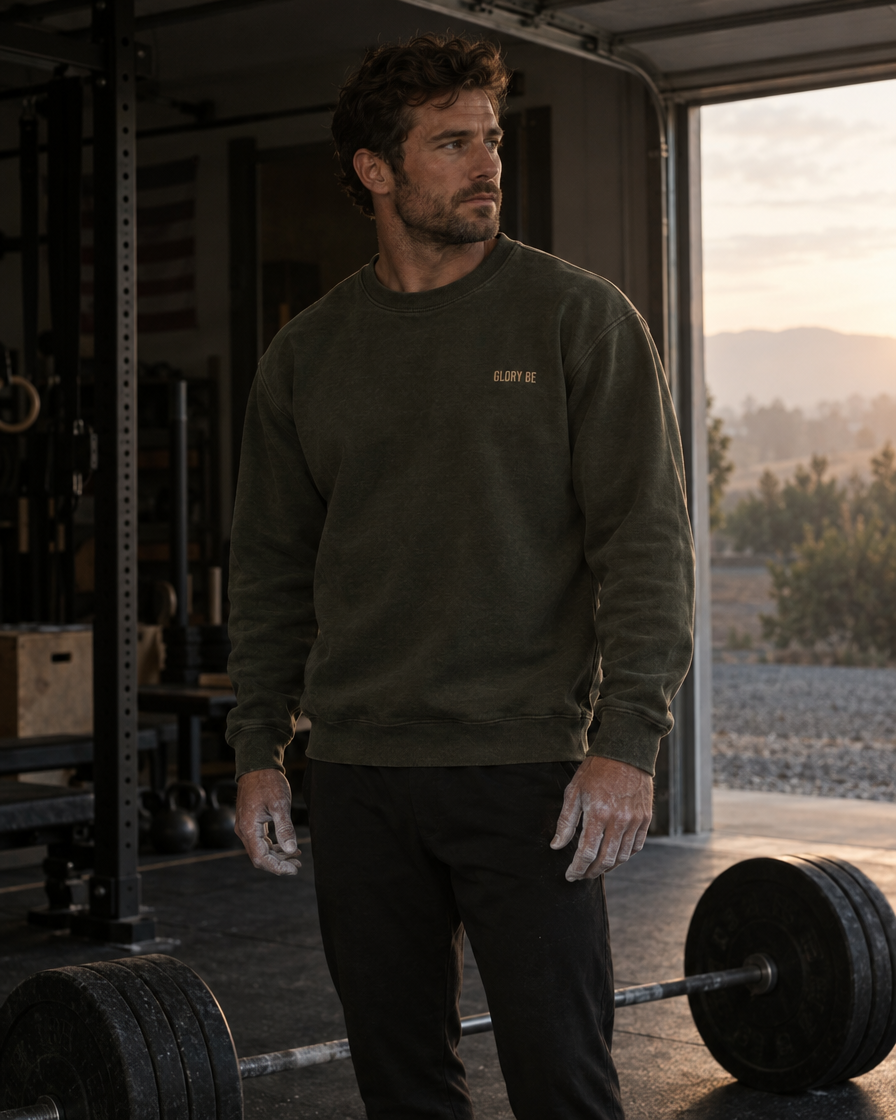 The Glory Be Crew in Olive worn in a garage gym